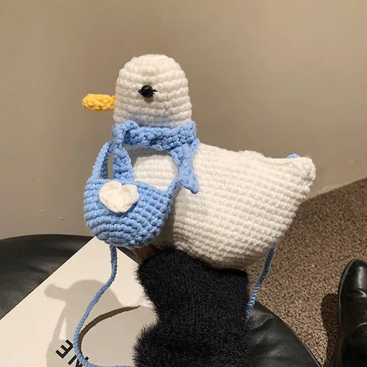 Bolso de lana hecho a mano con un bonito diseño de dibujos animados de pato.